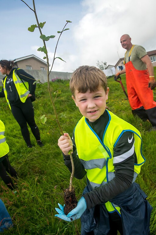 Tree planting at Holmsgarth Brae with Bell's Brae School, Shetland Amenity Trust and Viking Energy Windfarm Project.